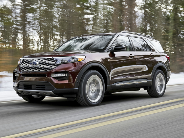 Maroon Ford Explorer Driving