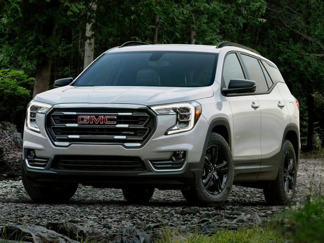 White GMC Terrain Driving