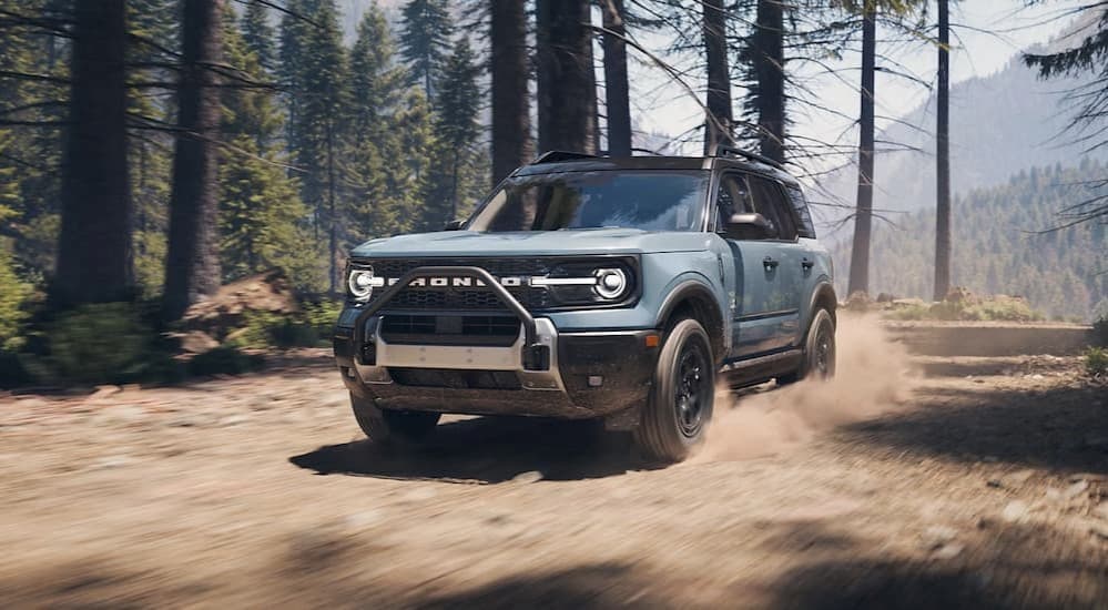A blue 2025 Ford Bronco Sport Outer Banks off-roading.