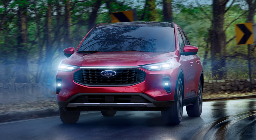 Red 2026 Ford Escape driving to a ford dealer near Elgin