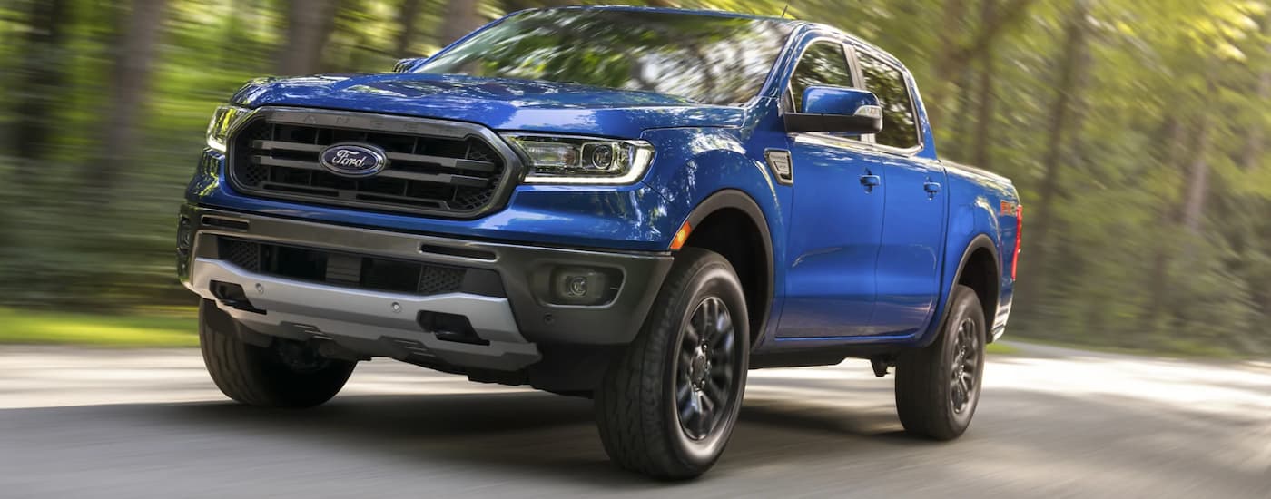 A blue 2021 Ford Ranger driving down a highway