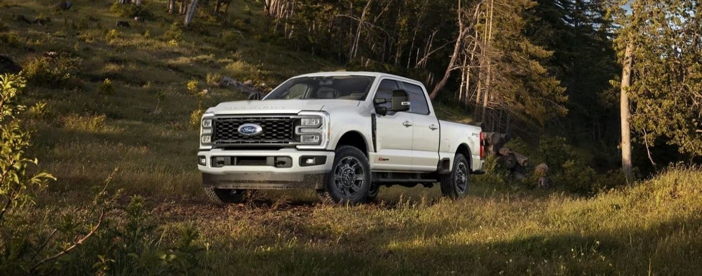 White 2024 Ford F-350 parked off-road at an angle