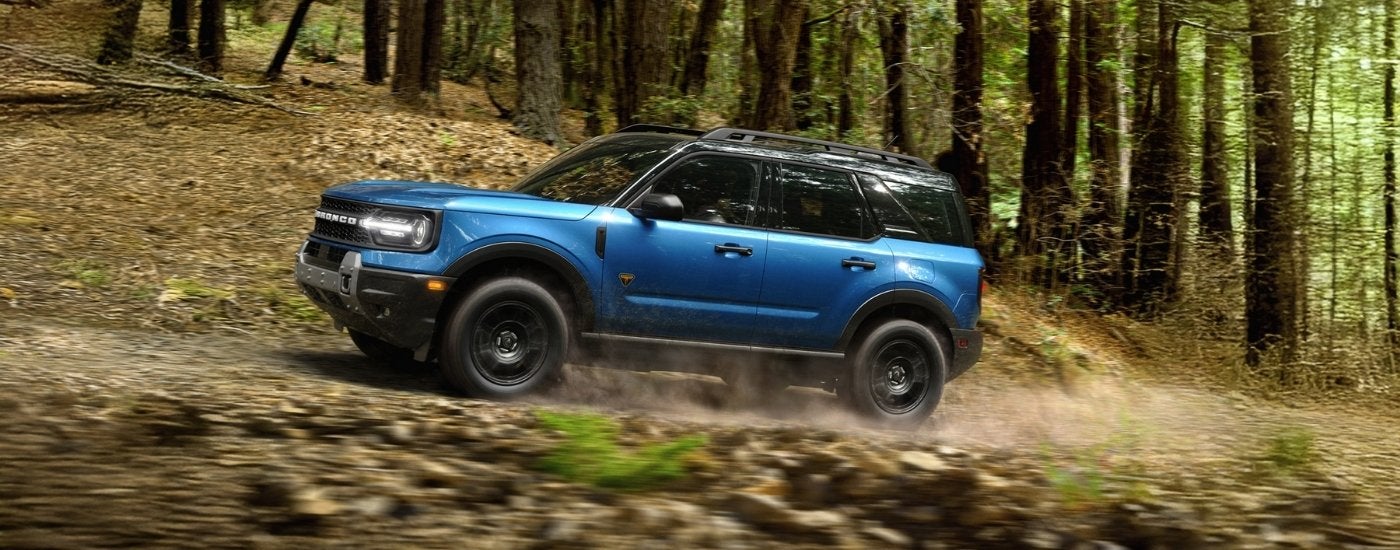 Blue 2026 Ford Bronco Sport Badlands driving off-road