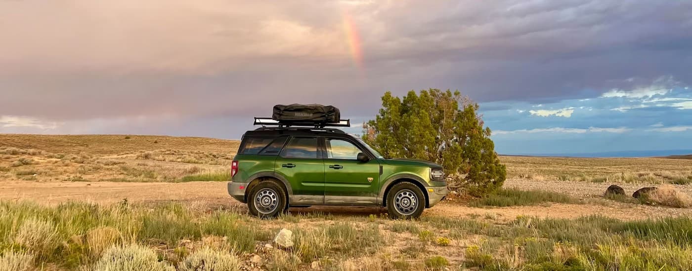 A green 2025 Ford Bronco Sport for sale near Bloomington parked off-road.