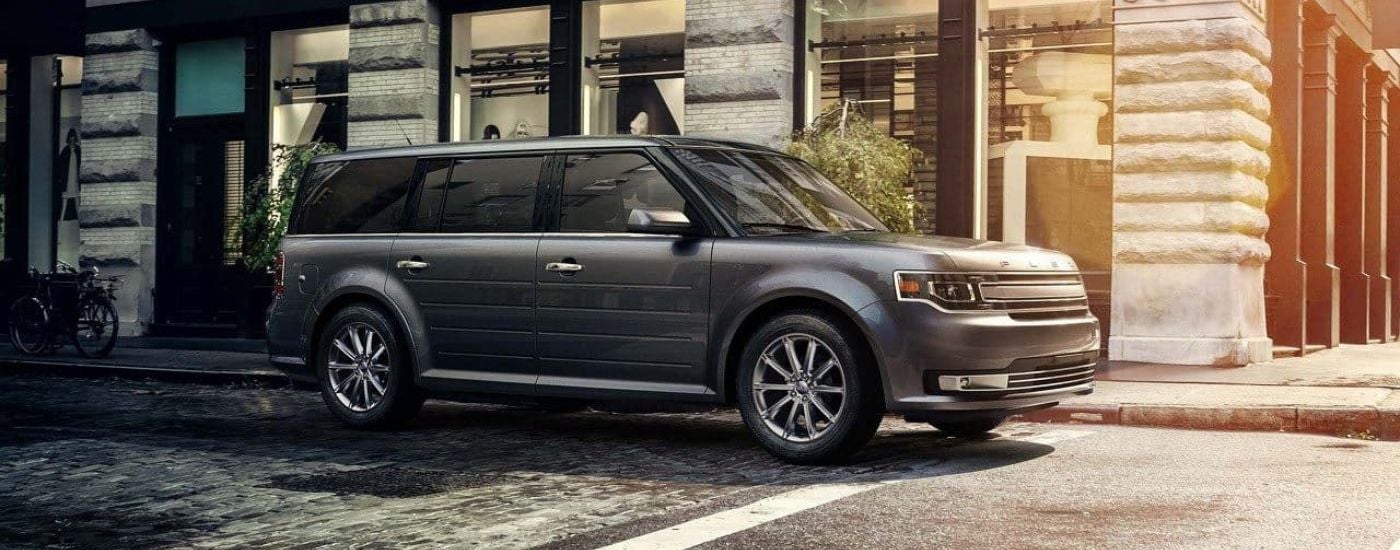 A grey 2018 Ford Flex is shown parked at an intersection.